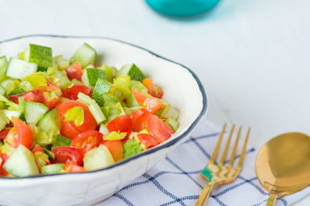 mediterranean salad in white bowl healthy food on tableの写真素材