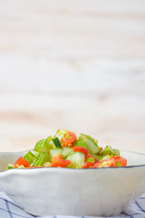 mediterranean salad in white bowl healthy food on tableの写真素材