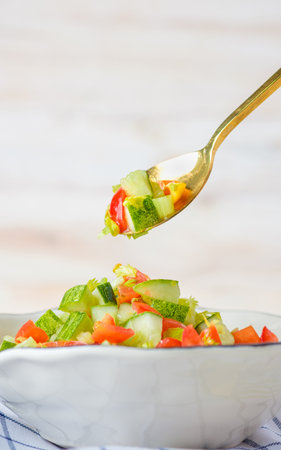 mediterranean salad in white bowl healthy food on tableの写真素材