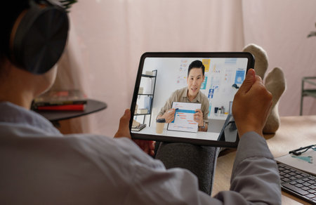 asian woman video conference online at home with relax poseの写真素材