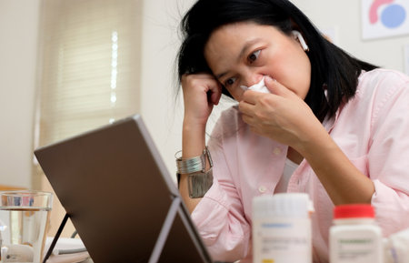 asian woman telemedicine doctor online visit with computer at homeの写真素材