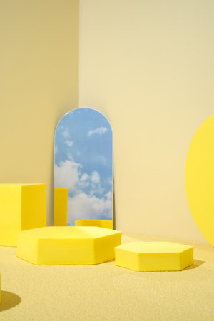 Yellow pedestal product display background with modern geometric block and mirror sky in sunshine light with summer feelの写真素材