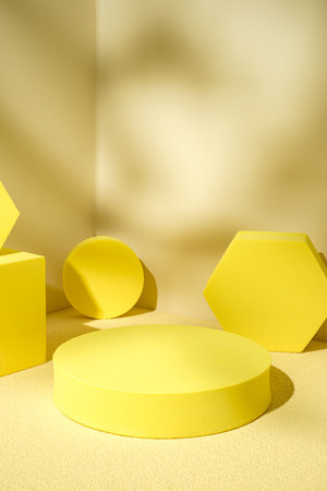 Yellow pedestal product display background with modern geometric block in sunshine light shadow with summer feelの写真素材