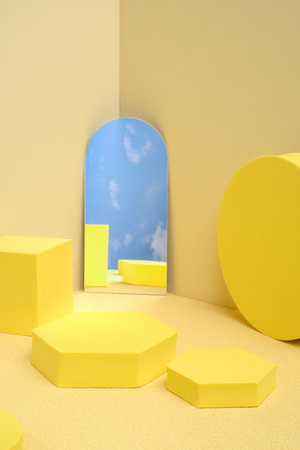 Yellow pedestal product display background with modern geometric block and mirror sky in sunshine light with summer feelの写真素材