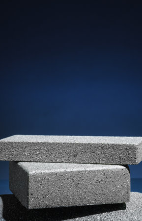 Stone block pedestal stage product display background on navy color.zen like backdropの写真素材