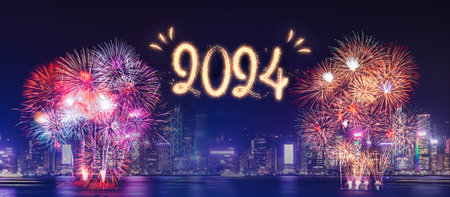 Happy new year 2024 firework over cityscape building near sea at night time celebrationの写真素材