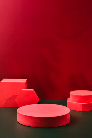 Red pedestal product display and ribbon on red and dark green background with modern geometric block,christmas backgroundの写真素材