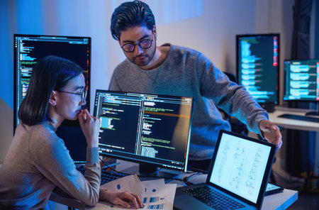 asian and Indian Developer  devops team discussion  about coding promgram with software computer at...