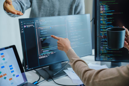 asian and Indian Developer team discussion feedback analysis coding data with software computer at...