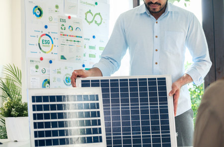 Diversity team presentation new design solar cell panel renewable energy innovation at officeの写真素材