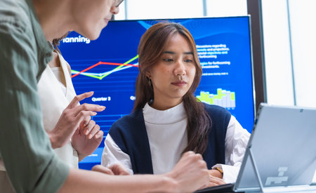 team of financial discussion business planning, analyzing digital financial data and strategy in a...