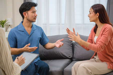 Asian marriage spouses relationship crisis conflict visit appointment psychotherapist officeの写真素材