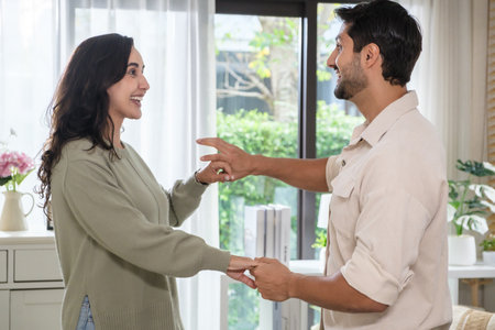 Happy couple at home in joyful movement and playful emotion, celebrating love, lifestyle,の写真素材