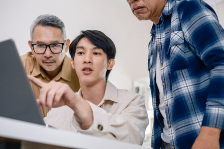 Group of asian senior in a collaborative software development analyzing  flowcharts  during a bootcamp trainingの写真素材