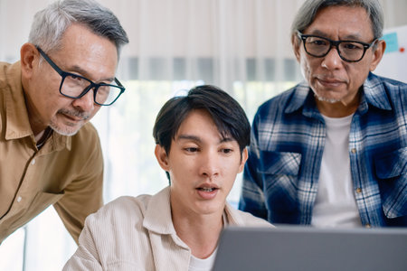 Group of asian senior in a collaborative software development analyzing  flowcharts  during a bootcamp trainingの写真素材