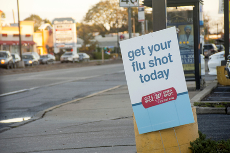 Street banner advertising where to get flu shotsのeditorial素材