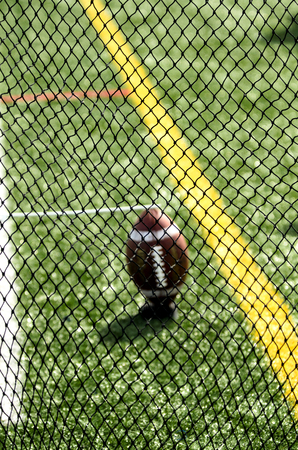 Football Seen Through Punter's Net On Fieldの写真素材