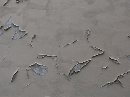 Texture of peeled plaster at an old house. Old wall with Crags.の写真素材
