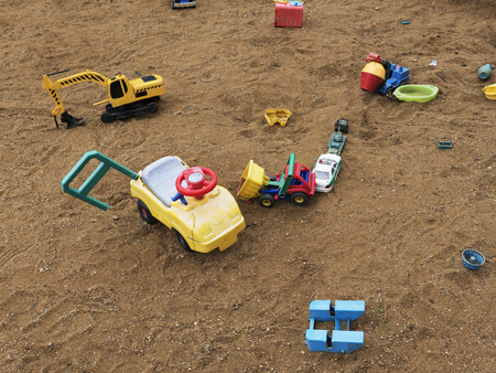 Children's playground with a sandbox and toys. Relaxation park, leisure place for families and children. Daily picture without characters.の写真素材