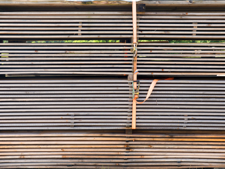 Cut wood spruce boards. Timber, planed boards. Carpenter texture and background. Wooden material for...