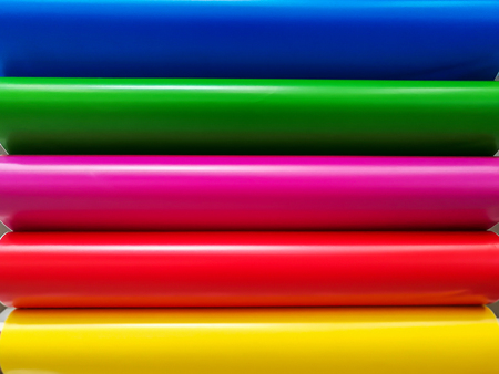 Glossy PVC plastic cards to select the color of furniture lined fan close-up on a white backgroundの写真素材