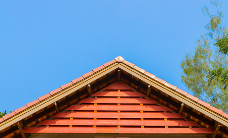 Brand new red rooftop against blue sky in thailandの写真素材