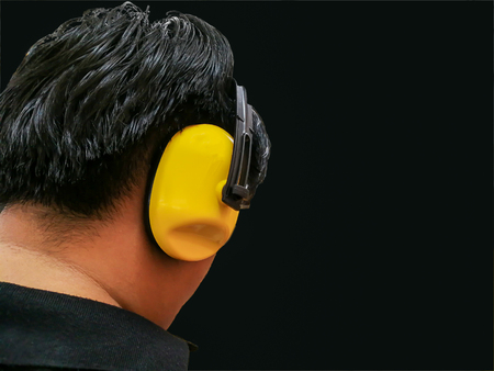 Engineer checking noise levels in a plantの写真素材