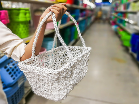 Women holding empty shopping basket - Shopping conceptの写真素材