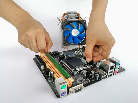 worker is repairing a computer in machine shopの写真素材
