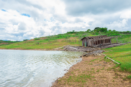 old wood cottage home on river sideの写真素材