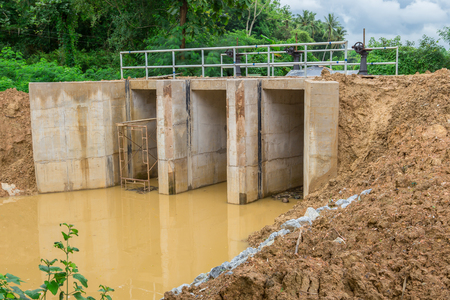 Water gate was located in irrigational canal at rural area due to water reservation for agricultural purposes.の写真素材