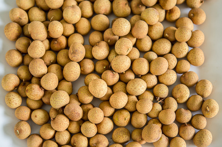 Stack pile of fresh fruit longan backgroundの写真素材