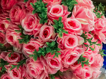 Roses. Large bouquet. Pattern of roses. Floral background. Lot of artificial flowers in colorful composition. natural roses backgroundの写真素材