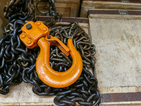 New chain cargo sling. Black steel chain and yellow cargo hooksの写真素材