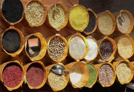 Market stall with a basket full of haricot beansの写真素材