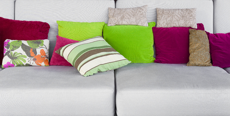 Colorful cushions on white sofas.の写真素材