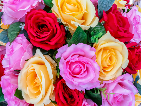 Roses. Large bouquet. Pattern of roses. Floral background. Lot of artificial flowers in colorful composition. natural roses backgroundの写真素材