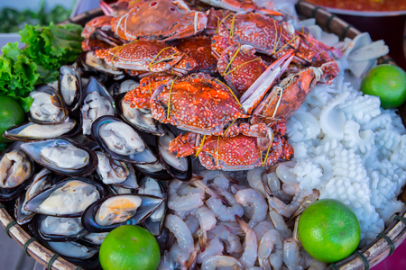 Seafood on ice at the fish marketの写真素材