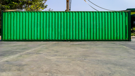 Industrial crane loading Containers in a Cargo freight ship,Container Cargo freight ship by crane bridgeの写真素材