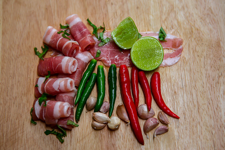 Delicious portion of fresh salmon fillet with aromatic herbs, spices and vegetables - healthy food, diet or cooking conceptの写真素材