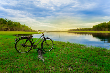 old bicycle on river and nature backgroundの写真素材