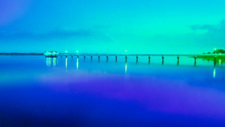 Beautiful clouds reflected in surface water at sunny summer day,Bridge and dam across the Dnieper riverの写真素材