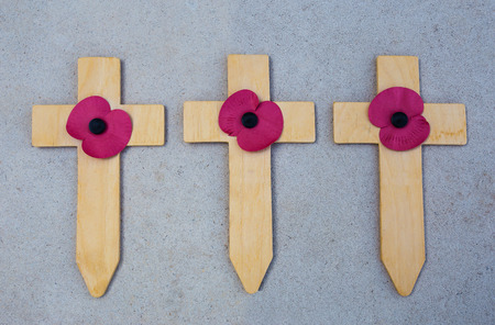 A vintage wooden Christian cross crucifix on a wood plank backgroundの写真素材