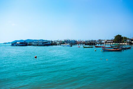 Boat transports tourists at samet island port.