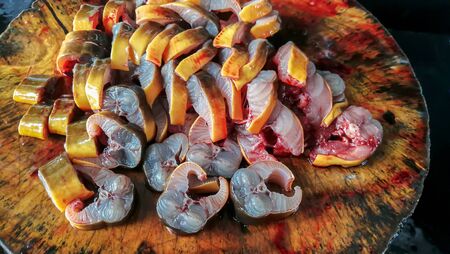 Fresh cleaned raw eels on a dish ready to cook