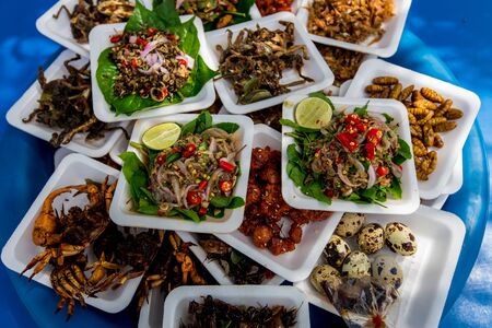 Roasted Fish Skewers - Laos Style. Grilled fish is on the counter of a street shop. Street food in...