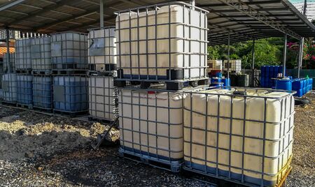 row of big plastic tank barrel at rubber factory