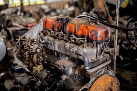 Old engines of the car are dirty and rusty at the junk yard