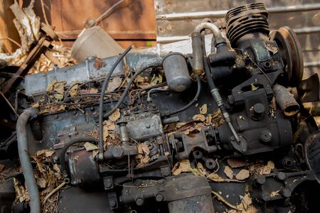 Old engines of the car are dirty and rusty at the junk yard