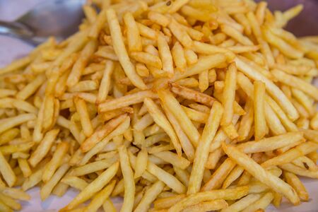 closeup group of French fries, potato, tiny slices, stick, chip, yellow crispy at asia fresh market , secret delicious recipe snack, backgrounds, wallpaperの写真素材